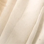 Rideau voilage beige, ajout subtil à votre intérieur