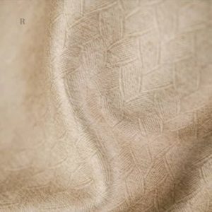 Textile décoratif beige avec motif géométrique moderne